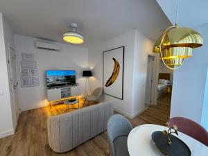 a living room with a couch and a table at PIO XII XXl B in Talavera de la Reina