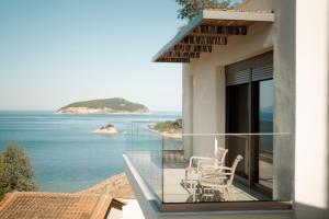a balcony with a view of the ocean at Aktis Seaside Living in Iraklitsa