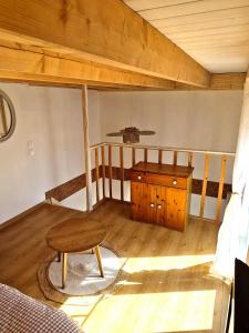 a room with a bed and a table and a stool at Cozy Studio in Marck +2 photos