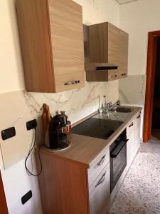 a kitchen with a sink and a counter top at Dimora Civita in Castelcivita