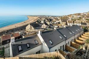 an aerial view of a houses and the beach at Storm View in Castletown