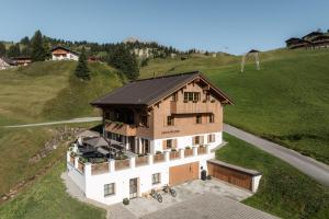 an overhead view of a house on a hill at Bergmähder - Alpine Residence in Oberlech