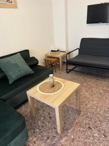 a living room with two couches and a coffee table at Central Michaniona AP in Nea Michaniona