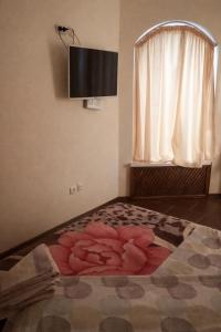 En eller flere senge i et værelse på Hotel Cetate - Apartamente Confortabile în Cahul + 16 billeder