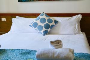 a bed with two pillows and a stuffed animal on it at Locanda Milano 1873 in Brunate +98 photos