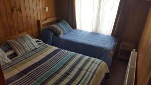 Postel nebo postele na pokoji v ubytování Hostal Costa Azul