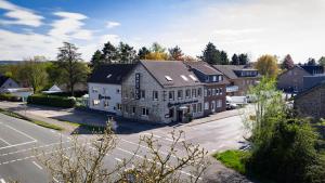 an aerial view of a house in a residential neighborhood at Hotel Zur Heide in Aachen