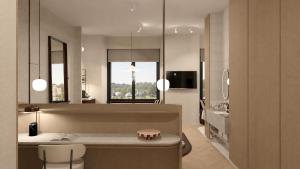 a bathroom with a counter and a sink in a room at Van der Valk Hotel Maastricht-Maas in Maastricht