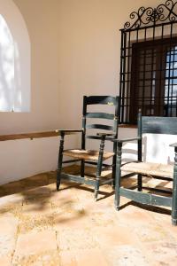 a room with two chairs and a table at Cortijo El Solano in Antequera +37 photos