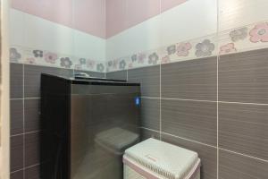 a bathroom with a toilet in a tiled wall at 3BR Beach Front Chalet On RedSea in Ain Sokhna +41 photos