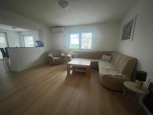 a living room with a couch and a table at Janez house in Metlika