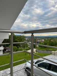 a car parked on a balcony with a view at Janez house in Metlika