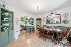 a kitchen and dining room with a table and chairs at Peaceful Lake Como Retreat in Lake Geneva