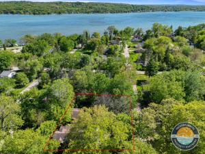 an aerial view of a park with trees and water at Peaceful Lake Como Retreat in Lake Geneva