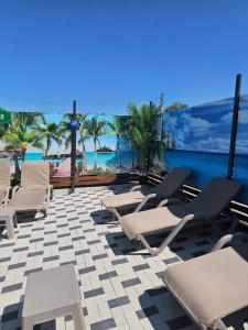a row of lounge chairs on a patio with the ocean at Эко Парк in Bălţi
