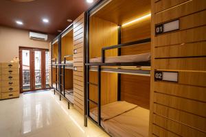 a room with four bunk beds in it at Saigon Box Hostel in Ho Chi Minh City