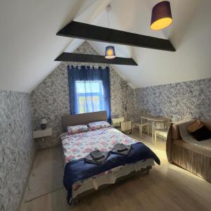 a bedroom with a large bed and a window at Vadim Home 2 in Ventspils +51 photos