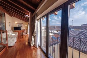 a balcony with a view of a living room at Phi Hotel Dei Medaglioni in Correggio