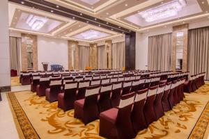 a large room with rows of chairs in it at Soaltee Westend Premier in Nepālganj +52 photos