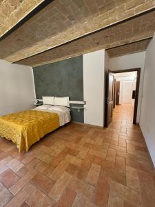a bedroom with a bed and a tiled floor at Regis Resort & Wellness in Turrivalignani +26 photos