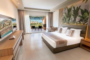 a hotel room with a bed and a balcony at Ali Baba Palace Resort - Families and Couples Only in Hurghada +128 photos
