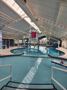a large swimming pool with blue water at 8 Moray View Seton Sands in Port Seton