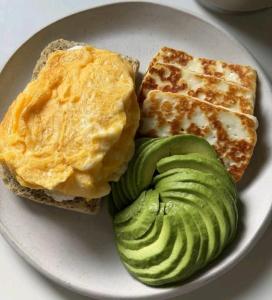 a plate of food with eggs and avocado and toast at Pine Breeze Getaway Lukenya in Athi River