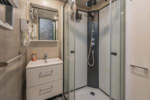 a bathroom with a shower and a sink and a toilet at L'Elan in Les Angles +12 photos