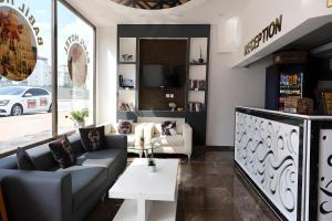 a living room with a couch and a table at Babil Hotel in Antalya