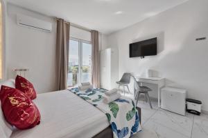 a bedroom with a bed and a desk and a window at Sara Venice station in Mestre