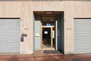 an entrance to a building with two garage doors at Sara Venice station in Mestre