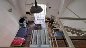 a living room with a couch and a loft at Malvasia rooms in Brindisi