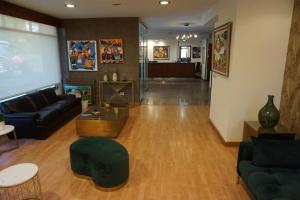 a living room with a couch and a table at Hotel Stellamaris in Combarro