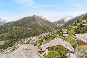 an aerial view of a village in the mountains at Chalet SkyLodge by Mrs Miggins in Grimentz