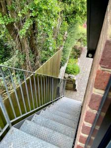 a set of stairs leading up to a house at Hunters Hide Apt in Littlehampton