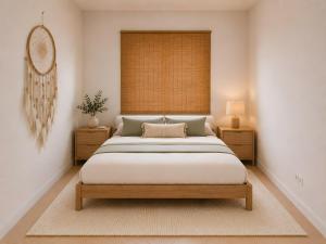a bedroom with a large bed and two night stands at Apartment Simone in Baja Sardinia +6 photos