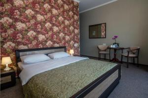 Postel nebo postele na pokoji v ubytování Mini Hotel Ryleev