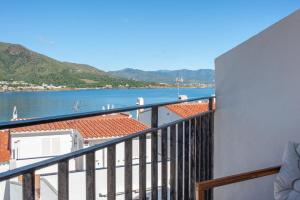 a balcony with a view of the water at Hostal Boutique Es Grop in Port de la Selva