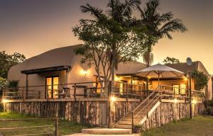 a dome house with stairs leading up to it at Howberry Hills in Plettenberg Bay