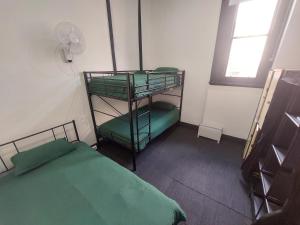 a room with two bunk beds and a window at The Vine & Lamb in Saint Arnaud +7 photos