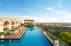 a view of a swimming pool on top of a building at JW Marriott Hotel Chandigarh in Chandīgarh