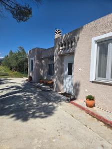 a brick house with a window on the side of it at Olive garden cottage, Krines in Vélon