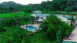 an aerial view of a house with a pool and trees at Resta Lodge in Kariba