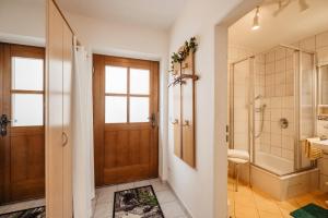 a bathroom with a shower and a toilet at Ferienappartement Donautal in Obernzell +33 photos