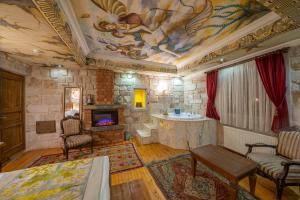 a living room with a painting on the ceiling at Corner İn Cappadocia in Ortahisar