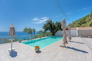 a villa with a swimming pool and a view of the ocean at Tenuta Donna Carmela in Pisciotta