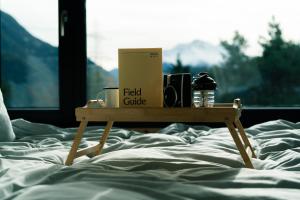 a box on a table on a bed at Unbound Hütte Lenzerheide in Tiefencastel