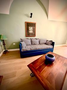 a living room with a couch and a table at Donna Lucia Apulian Experience in Ruvo di Puglia
