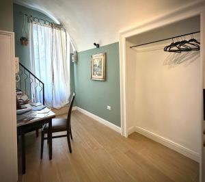 a dining room with a table and a window at Donna Lucia Apulian Experience in Ruvo di Puglia