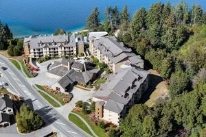 an aerial view of a resort with a road at Rendezvous Heritage Hotel Queenstown in Queenstown